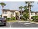 Inviting two-story condo with lush landscaping and palm trees at 428 Moorings Cove Dr # 7F, Tarpon Springs, FL 34689