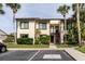 Inviting two-story condo with lush landscaping and palm trees at 428 Moorings Cove Dr # 7F, Tarpon Springs, FL 34689