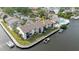 Waterfront condos with boat docks, grassy lawns, and community pool offer an attractive coastal living experience at 428 Moorings Cove Dr # 7F, Tarpon Springs, FL 34689