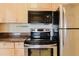 Kitchen featuring light wood cabinets and stainless appliances at 428 Moorings Cove Dr # 7F, Tarpon Springs, FL 34689