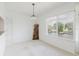 Bright living room boasts serene water views, white walls and trim, and charming, natural light at 428 Moorings Cove Dr # 7F, Tarpon Springs, FL 34689