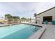 Community pool with lounge chairs offers a refreshing oasis for residents at 428 Moorings Cove Dr # 7F, Tarpon Springs, FL 34689