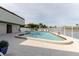 Refreshing community pool area with pristine clear water, lounge chairs, and a meticulously maintained pool deck at 428 Moorings Cove Dr # 7F, Tarpon Springs, FL 34689