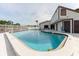 Sparkling community pool area offering a refreshing escape, comfortable seating, and easy access to nearby facilities at 428 Moorings Cove Dr # 7F, Tarpon Springs, FL 34689