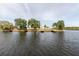 Expansive waterfront view showing calm waters, multiple docks, and lush green landscaping at 428 Moorings Cove Dr # 7F, Tarpon Springs, FL 34689