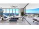 Bright, modern living room with floor-to-ceiling windows and a spacious balcony overlooking the city and water at 520 N Tampa St # 1508, Tampa, FL 33602