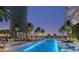 Resort-style outdoor pool with lounge chairs, palm trees, and city views at 520 N Tampa St # 1508, Tampa, FL 33602