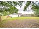Large, private backyard featuring a wooden fence and ample space for recreation and entertaining at 538 Summer Sails Dr, Valrico, FL 33594