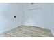 Spacious bedroom with wood-look floors, neutral paint, and a double-door closet at 538 Summer Sails Dr, Valrico, FL 33594