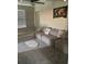 Comfortable bedroom with plush carpet, neutral tones, and ample seating space at 5511 Rainwood Meadows Dr, Apollo Beach, FL 33572