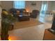 Inviting living room with tile floors, neutral tones, comfortable seating, and plenty of space at 5511 Rainwood Meadows Dr, Apollo Beach, FL 33572