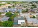 An aerial view showcases a neighborhood with mature trees, single-Gathering homes and in-ground pools at 5810 8Th Ave, New Port Richey, FL 34652