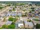 Aerial shot showcasing the neighborhood with houses, streets, trees, and community overview at 5810 8Th Ave, New Port Richey, FL 34652