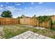 Fenced backyard with grassy areas at 5810 8Th Ave, New Port Richey, FL 34652