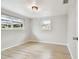 Bedroom with light wood floors and natural light at 5810 8Th Ave, New Port Richey, FL 34652