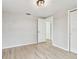 This bedroom has a glimpse into another room, a closet, and simple light fixtures at 5810 8Th Ave, New Port Richey, FL 34652