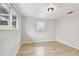 Bright bedroom filled with light and wood-look vinyl plank floors at 5810 8Th Ave, New Port Richey, FL 34652
