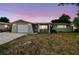 Charming single-story home with a well-maintained lawn and a one-car garage at 5810 8Th Ave, New Port Richey, FL 34652
