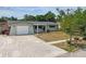 Charming single-story home with an attached garage and well-maintained front yard at 5810 8Th Ave, New Port Richey, FL 34652