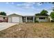 Charming single-story home with a well-maintained lawn and a one-car garage at 5810 8Th Ave, New Port Richey, FL 34652