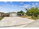 Lovely single-story home featuring a spacious driveway, lush landscaping and one-car garage at 5810 8Th Ave, New Port Richey, FL 34652