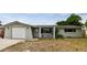 Charming single-story home with attached garage and well-maintained front yard at 5810 8Th Ave, New Port Richey, FL 34652