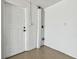 This garage features a white door and utility connections at 5810 8Th Ave, New Port Richey, FL 34652