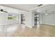 Bright living area with hardwood floors, sliding glass doors to the pool, and ample space at 5810 8Th Ave, New Port Richey, FL 34652
