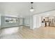Open-concept living space flows into an updated kitchen with stainless steel appliances and light wood floors at 5810 8Th Ave, New Port Richey, FL 34652