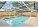 Enjoy the fenced-in pool with screen enclosure at 5810 8Th Ave, New Port Richey, FL 34652