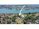 A captivating aerial view of a waterfront property with mature trees offering a private backyard oasis at 636 Sunset S Dr, St Petersburg, FL 33707