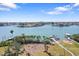 Aerial view of waterfront property with lush landscaping, docks and serene inlet at 636 Sunset S Dr, St Petersburg, FL 33707