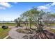 Long paver driveway leading to lush landscaping and bay views at 636 Sunset S Dr, St Petersburg, FL 33707