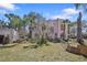 Charming Spanish style home with stucco exterior, multiple windows, and lush landscaping at 636 Sunset S Dr, St Petersburg, FL 33707