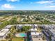 An aerial view of the condos showcasing the beautiful neighborhood and community pool at 8765 Bardmoor Blvd # 107, Seminole, FL 33777
