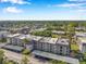 An aerial view of the condos, including covered parking, manicured landscaping and close proximity to Tampa Bay at 8765 Bardmoor Blvd # 107, Seminole, FL 33777
