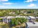 Overhead view of property featuring building exteriors and lush landscaping at 8765 Bardmoor Blvd # 107, Seminole, FL 33777