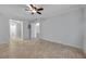 Bedroom featuring tile flooring, ceiling fan, and a window offering plenty of natural light at 8765 Bardmoor Blvd # 107, Seminole, FL 33777