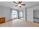 Comfortable bedroom with tile flooring, ceiling fan, and closet with mirrored doors at 8765 Bardmoor Blvd # 107, Seminole, FL 33777