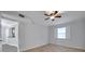 Bedroom featuring tile flooring, ceiling fan, and a window offering plenty of natural light at 8765 Bardmoor Blvd # 107, Seminole, FL 33777