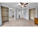 Spacious bedroom with tile flooring, ceiling fan, walk-in closet, and ample space at 8765 Bardmoor Blvd # 107, Seminole, FL 33777