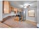 Efficient kitchen layout with stainless steel appliances and a tiled backsplash at 8765 Bardmoor Blvd # 107, Seminole, FL 33777