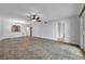 Bright living room featuring tile floors, neutral paint, and a ceiling fan at 8765 Bardmoor Blvd # 107, Seminole, FL 33777