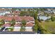 Aerial view of homes with tile roofs surrounded by palm trees at 903 Pinellas Bayway S # 308, Tierra Verde, FL 33715