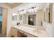 The bathroom features a double sink vanity with ample counter space and a large mirror at 903 Pinellas Bayway S # 308, Tierra Verde, FL 33715