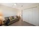 Cozy bedroom with couch, ceiling fan, and natural lighting from window at 903 Pinellas Bayway S # 308, Tierra Verde, FL 33715