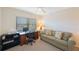 Bedroom with desk, sofa and natural light at 903 Pinellas Bayway S # 308, Tierra Verde, FL 33715