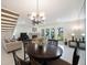 Bright living room with fireplace, ceiling fan, and sliding glass doors leading to outdoor space at 903 Pinellas Bayway S # 308, Tierra Verde, FL 33715