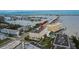 An aerial view of a condo complex featuring a community pool, manicured lawns, and convenient parking at 100 Bluff View Dr # 510A, Belleair Bluffs, FL 33770