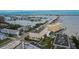 An aerial view of a condo complex featuring a community pool, manicured lawns, and convenient parking at 100 Bluff View Dr # 510A, Belleair Bluffs, FL 33770